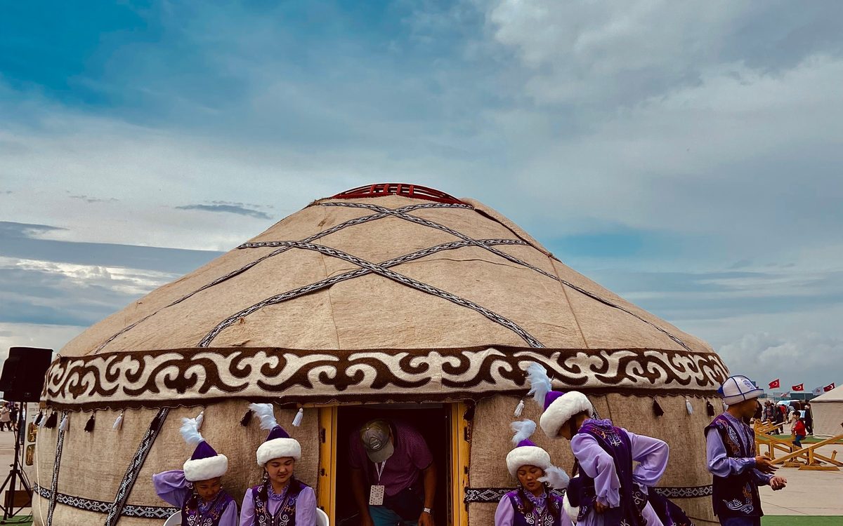 Traditional yurt and dancers in national dress, Kyrgyzstan
