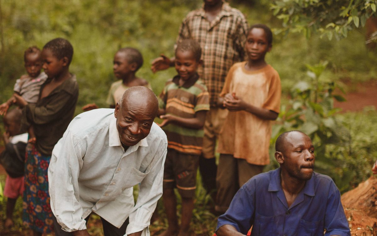 Village drummers playing outdoors in rural Uganda